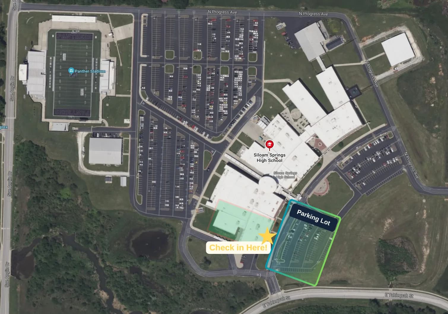 Satellite map of Siloam Springs High School with the parking lot and check-in point marked